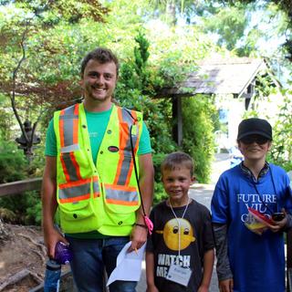 Alex helping the kids learn how to geocache.